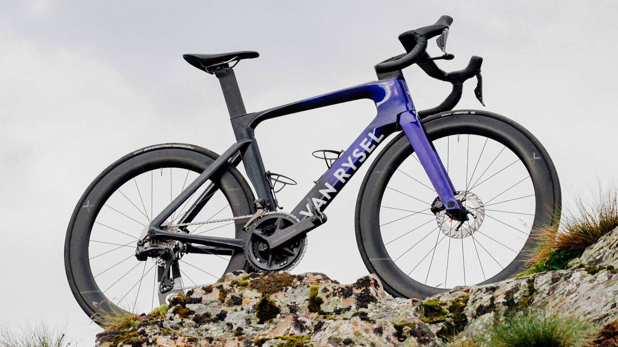 The Van Rysel RCR-F perched on a rock in the Alps