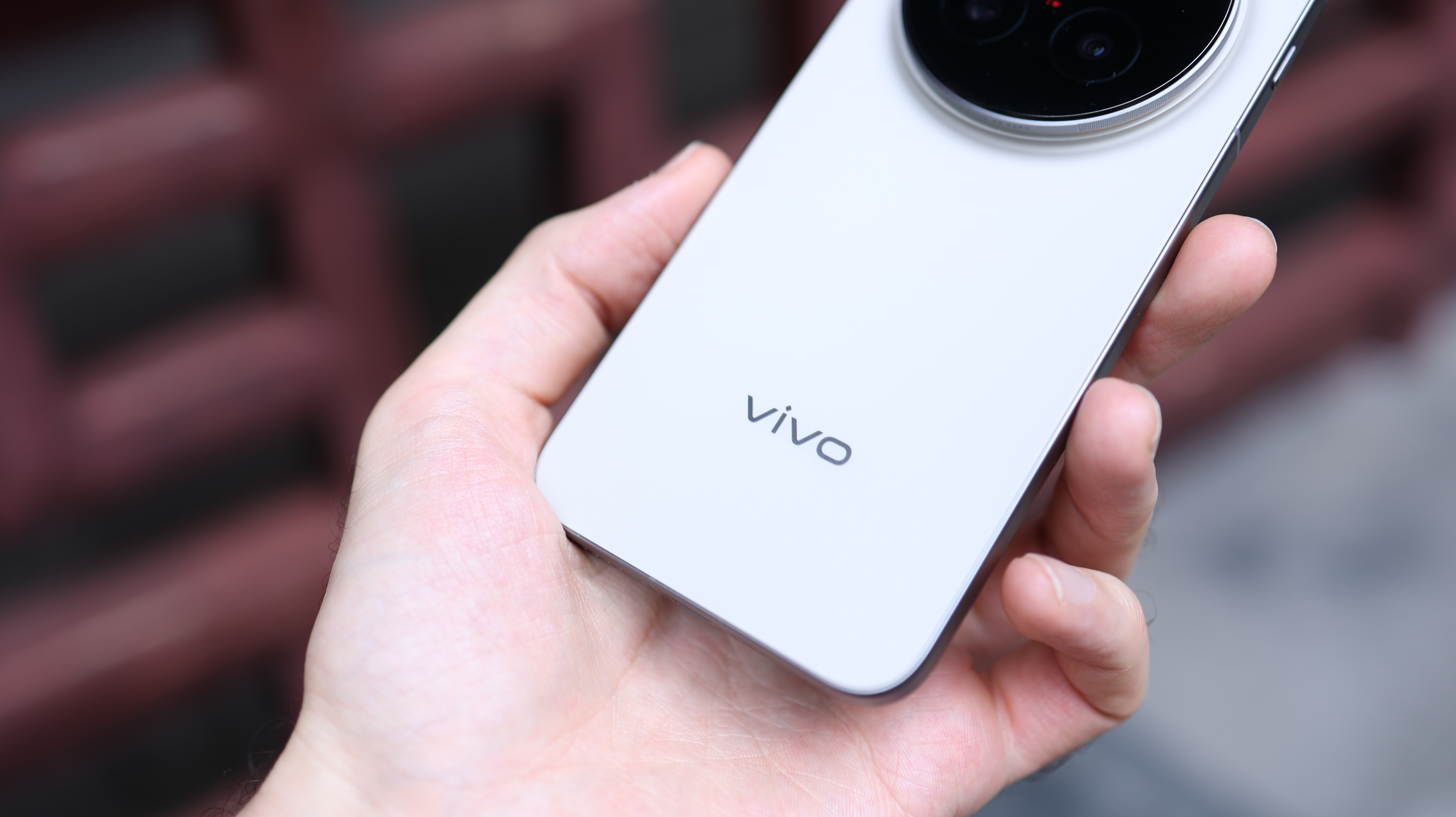 Vivo X300 Pro camera phone held in a hand