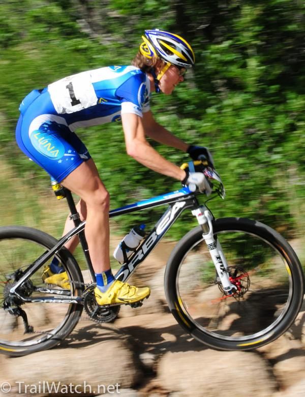 Georgia Gould (Luna Pro Team) floats over some rocks on the descent