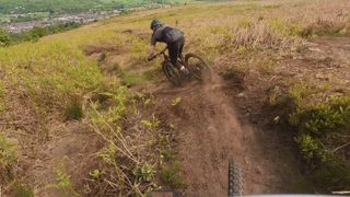 Rider on dusty moorland trail
