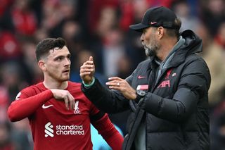 Liverpool's German manager Jurgen Klopp (R) gives instructions to Liverpool's Scottish defender Andrew Robertson during the English Premier League football match between Liverpool and Arsenal at Anfield in Liverpool, north west England on April 9, 2023