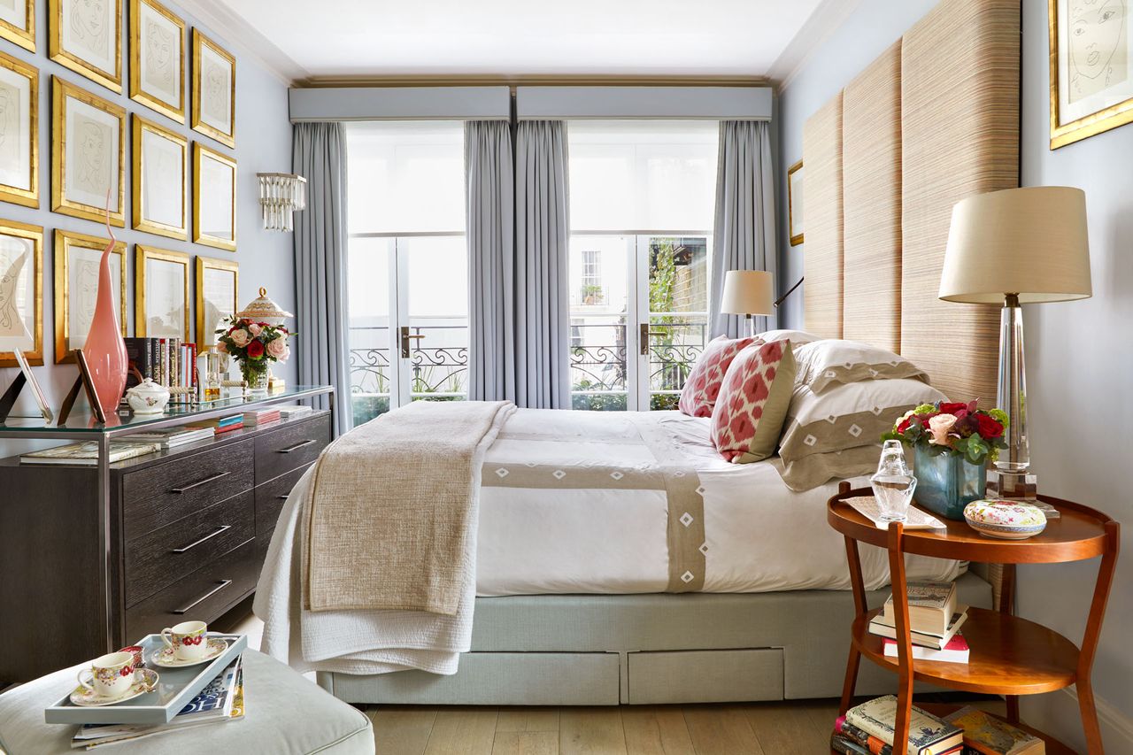 Grey and cream bedroom with three tiered wooden bedside table
