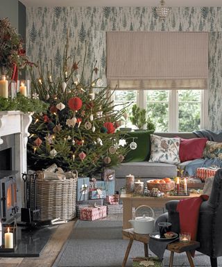 Christmas tree themes 2021 with paper and wooden decorations in a traditional living room