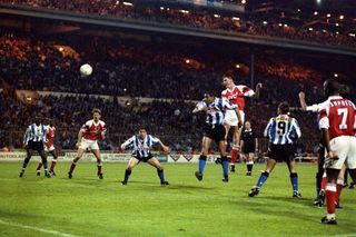 Andy Linighan heads Arsenal's extra-time winner against Sheffield Wednesday in 1993. It was the last time the FA Cup final was decided in a replay