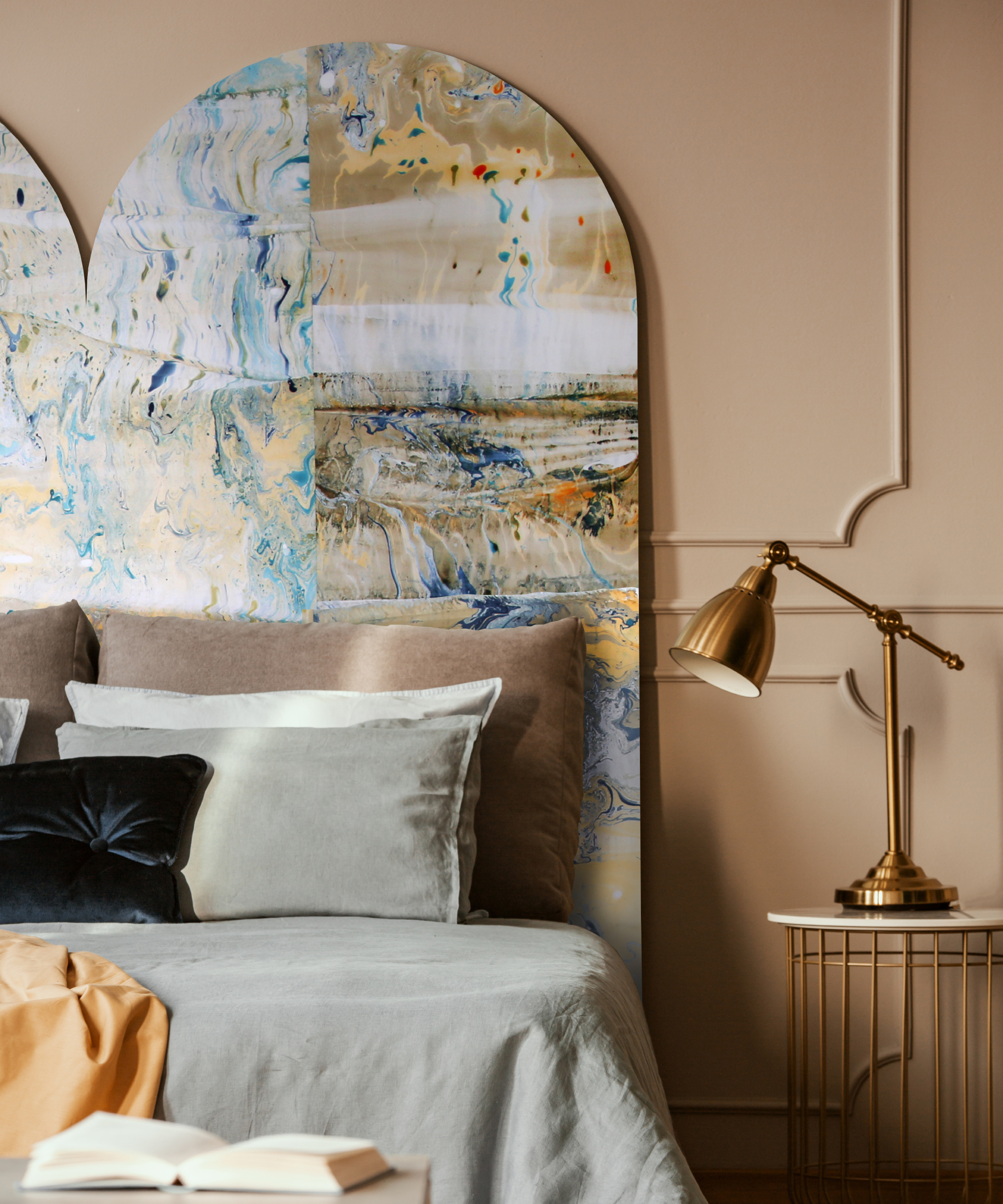 bedroom with marble effect wallpaper on arched panels behind bed