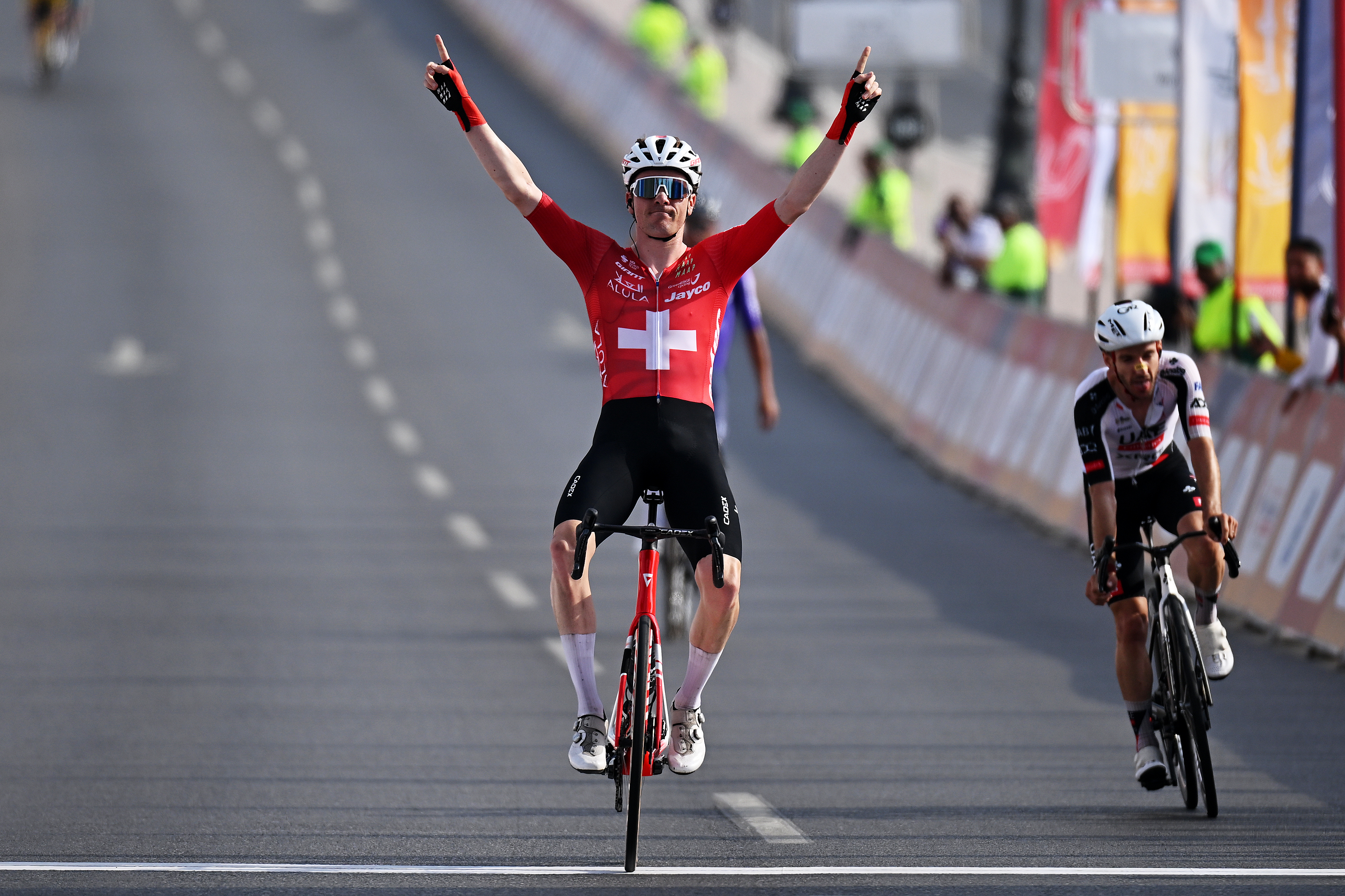 AL BUSTAN, OMAN - FEBRUARY 06: Mauro Schmid of Switzerland and Team Jayco AlUla celebrates at finish line as stage winner during the 4th Muscat Classic 2026 a 176.2km stage from Al Mouj to Al Bustan on February 06, 2026 in Al Bustan, Oman. (Photo by Dario Belingheri/Getty Images)