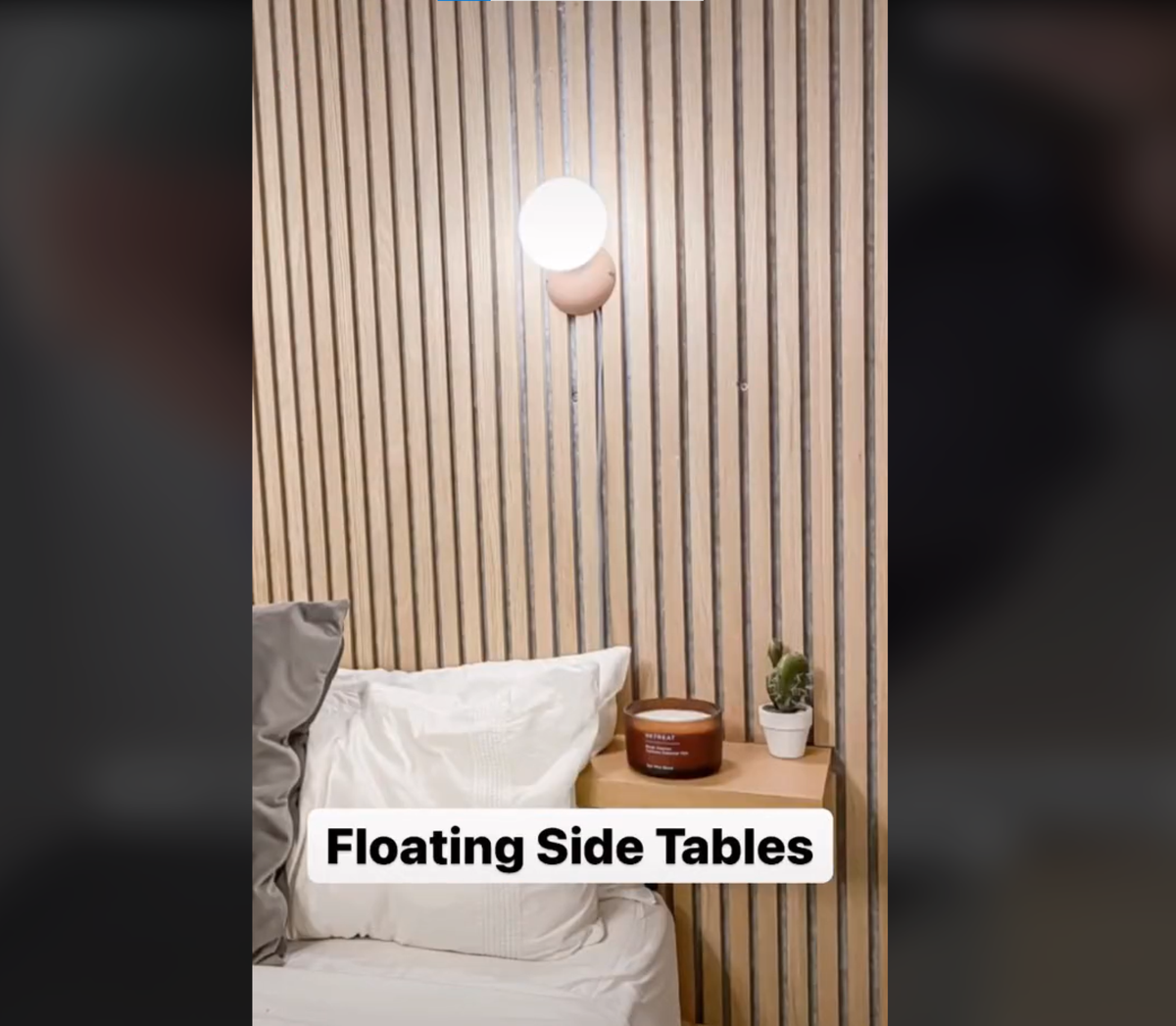 DIY floating shelves installed onto bedroom walls next to the bed