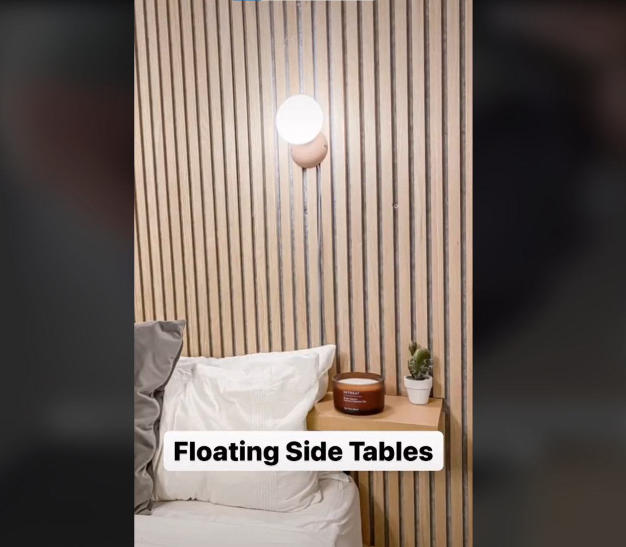 DIY floating shelves installed onto bedroom walls next to the bed