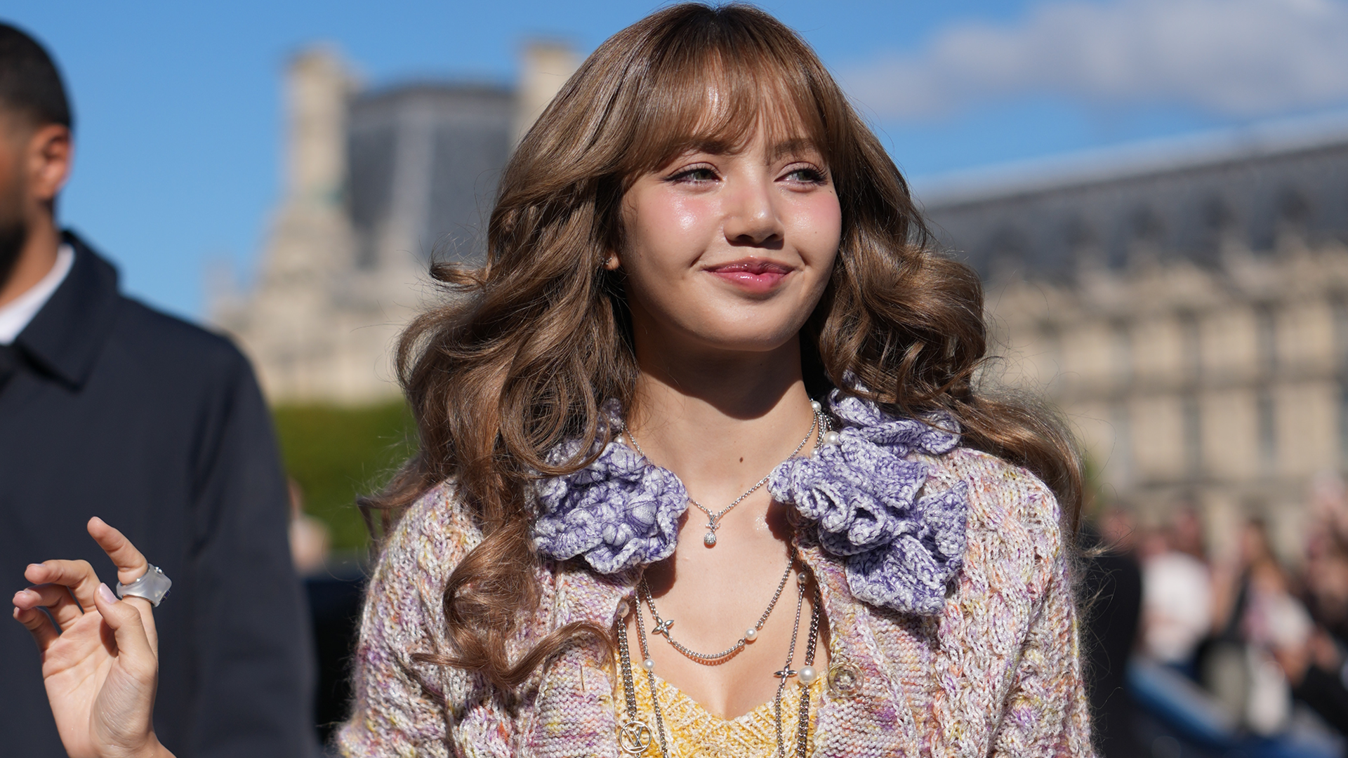 Lisa from Blackpink wore a knitted sweatsuit from Guest in Residence in the airport