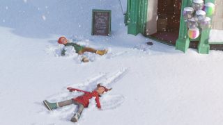 Two children making snow angels in That Christmas