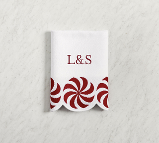 Peppermint swirl monogram hand towel for holiday season from Pottery Barn.