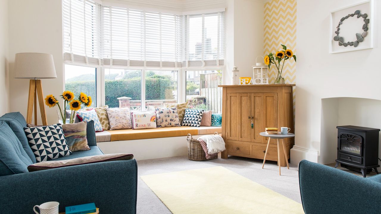 white living room with carpet flooring and sofa set