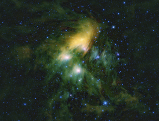 Bright yellow and green wisps of gas and dust emitted by stars of the Pleiades cluster are captured in this beautiful photo from NASA's Wide-field Infrared Survey Explorer. Located 445 light-years from Earth, the Pleiades star cluster is one of the closes