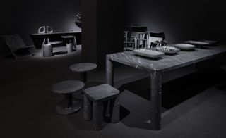 Dark style furniture featuring a graphite colour rectangular table and stools.