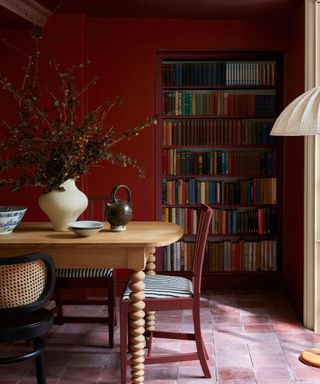 cherry red painted dining room with pink tiled floor