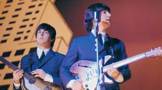 Paul McCartney (left) and John Lennon (1940 � 1980) performing with The Beatles during their American tour, August 1965.