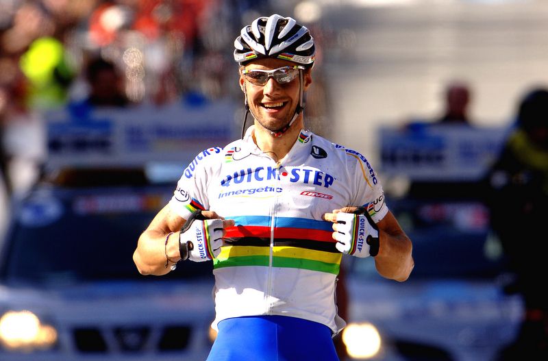 Tom Boonen points to his rainbow jersey celebrating his win