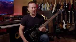 Brandon Small of Metalocalypse fame in his studio with a black Ibanez Iceman – now fretless – that he is selling in his official Reverb store.