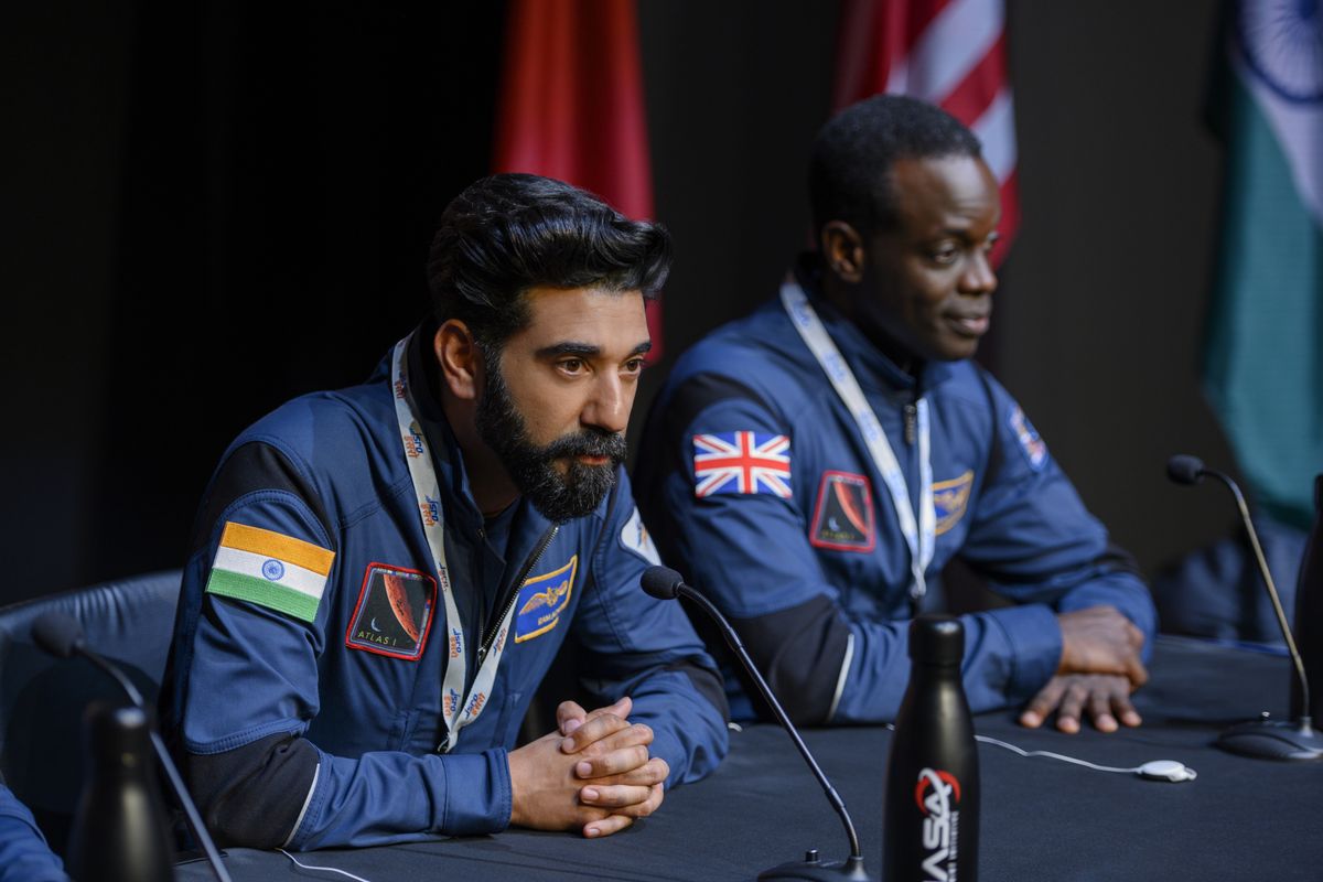 Ram (Ray Panthaki) and Kewsi (Ato Essandoh) address the public before embarking on a mission to Mars in "Away."
