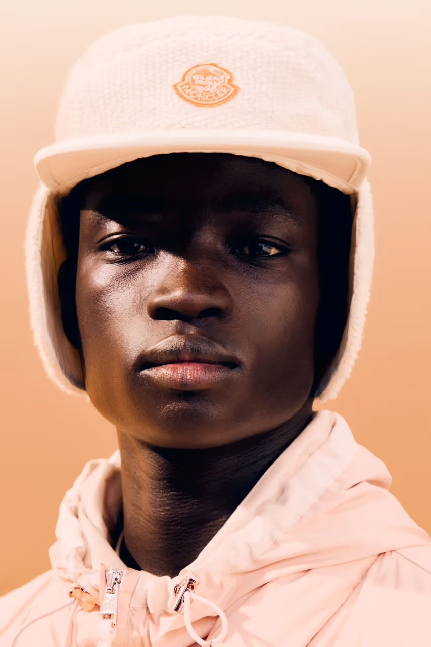 Moncler cream cap zoomed in on the model