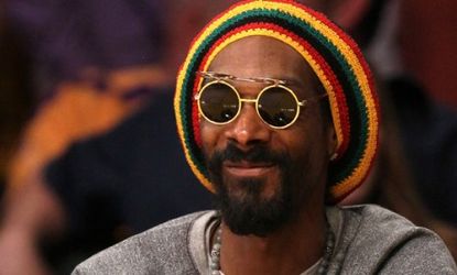 The former Snoop Dogg sports a Rastafarian look while watching a Los Angeles Lakers game May 18: The rapper is going is going reggae with a new sound, look, and name.