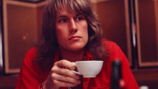 Alvin Lee drinking a cup of tea