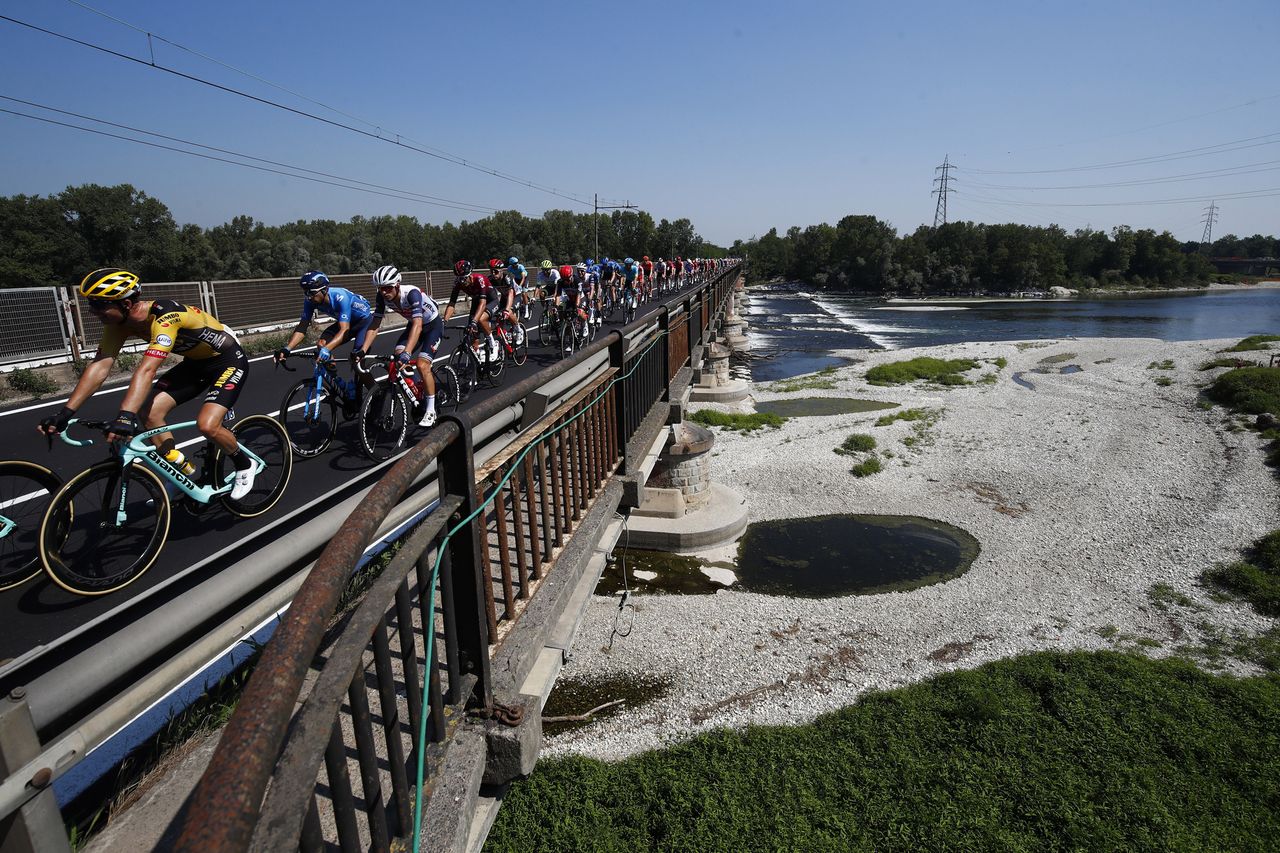 The peloton makes its way along the early flat roads