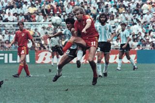 Belgium's Jan Ceulemans competes for the ball with Argentina's Diego Maradona at the 1986 World Cup.