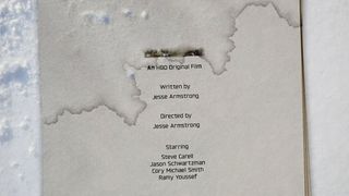 A piece of paper with the words 'an HBO Original film' on it next to a pile of snow 