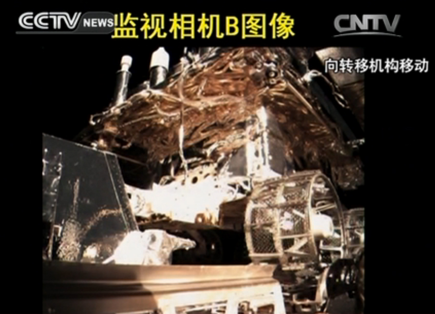 A camera on China&#039;s Chang&#039;e lunar lander shows the Yutu rover in its carrier just before deployment to the lunar surface on Dec. 14, 2013.