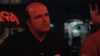 Peter Boyle as Wizard bathed in red light in Taxi Driver