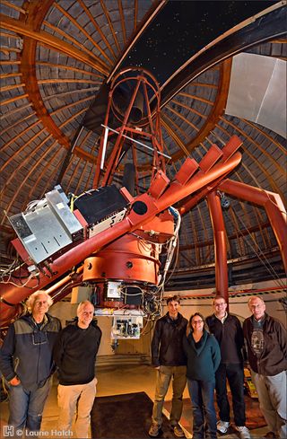 The near-infrared optical SETI (NIROSETI) team with their new infrared detector inside the dome at Lick Observatory. Left to right: Remington Stone, Dan Wertheimer, Jérome Maire, Shelley Wright, Patrick Dorval and Richard Treffers.