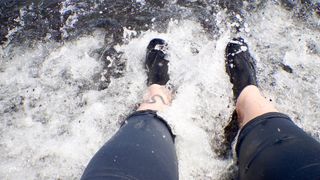 Surfer's feet in the water