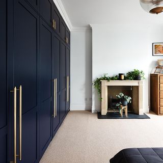 fitted blue wardrobes with gold handles