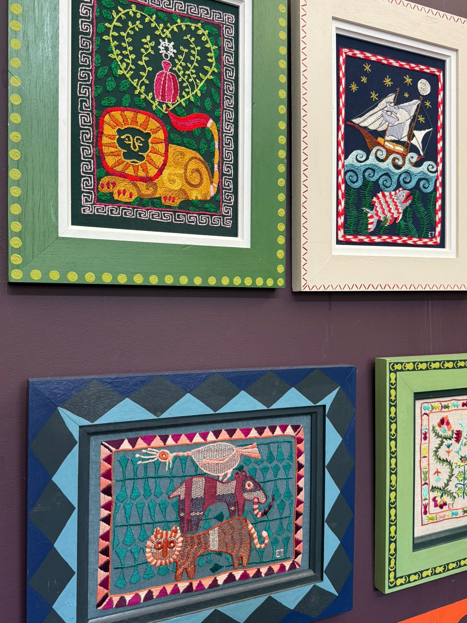 Some more needlepoint artworks, with lions, boats and cats
