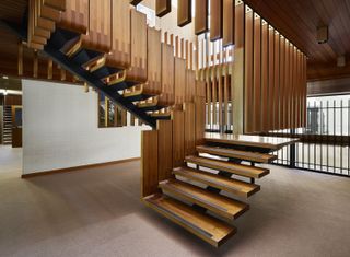 Tagletti’s design for the Italian Embassy in Canberra. A staircase with wooden floating stairs.