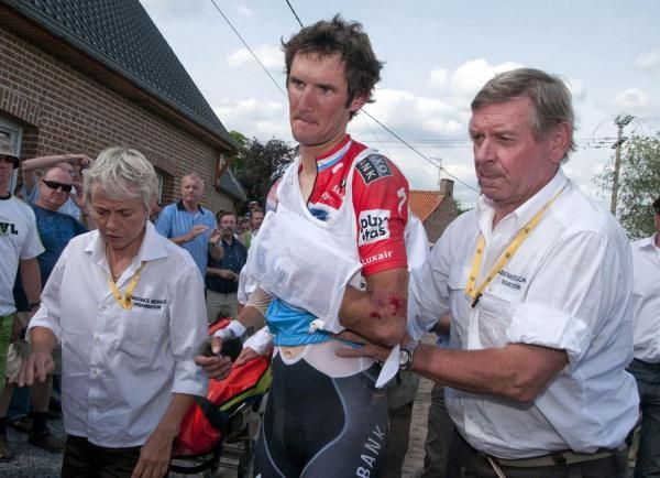 Frank Schleck tried to bury the pain &ndash; both physical and emotional &ndash; as he&rsquo;s helped into the race&rsquo;s medical transporter and taken to hospital.