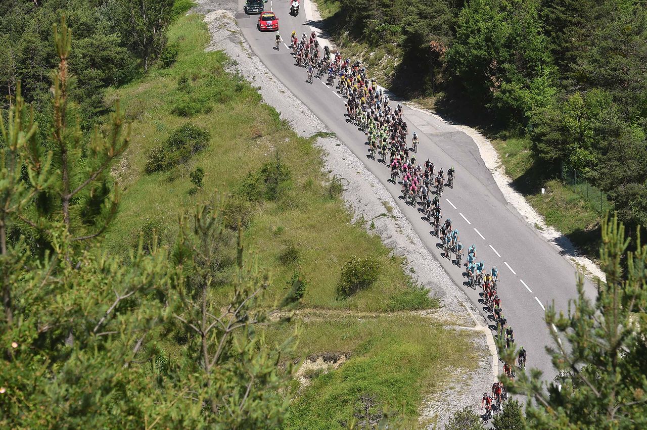 Riders begin to struggle as the road goes up