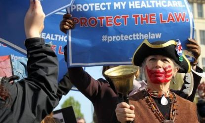 Tea Party member Susan Clark rings a bell as ObamaCare supporters demonstrate in front of the Supreme Court in March: If the court strikes down the entire law, it would be a "painful blow" fo