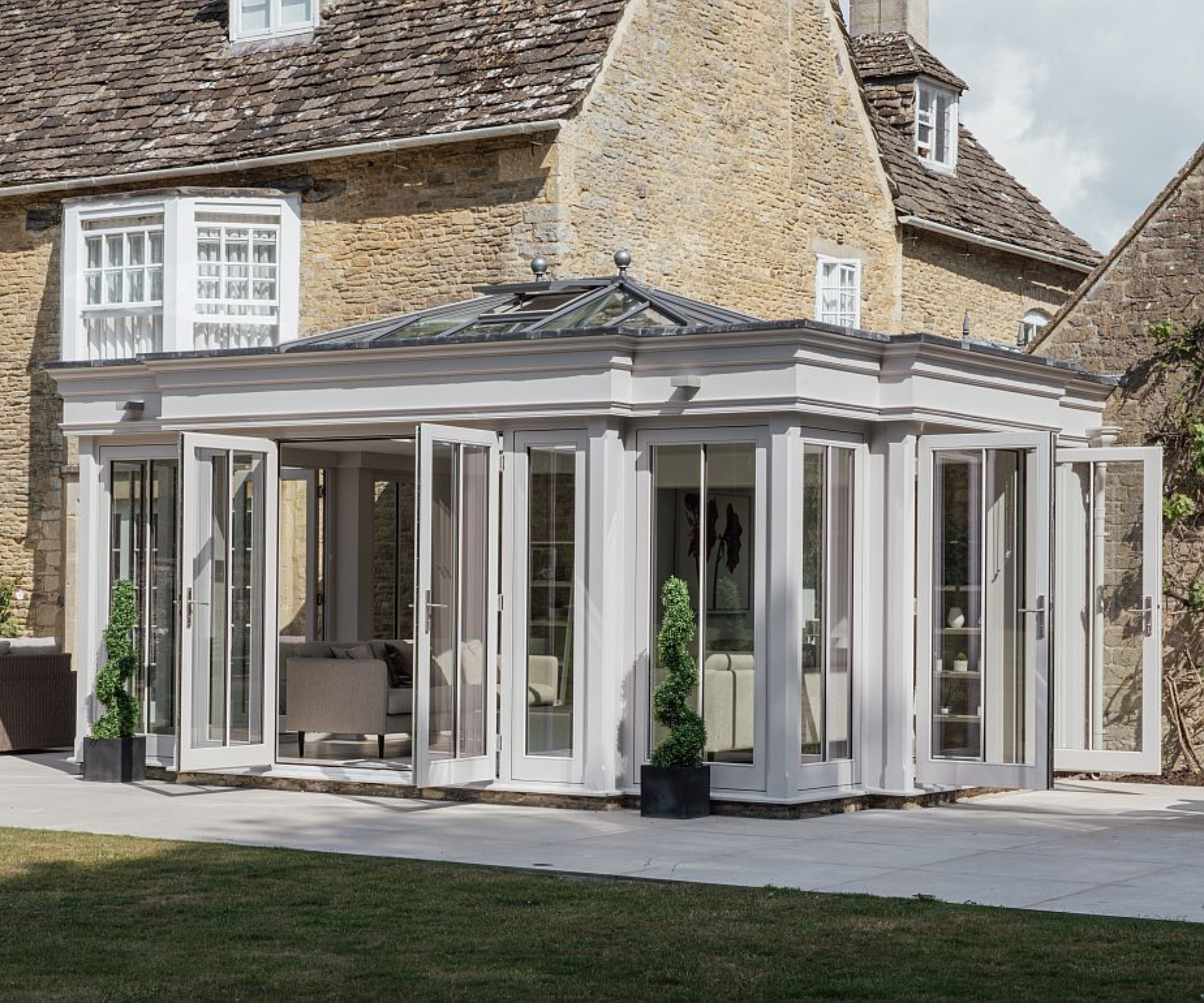 wraparound orangery in soft grey shade with two sets of patio doors