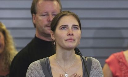 Amanda Knox pauses during her first news conference Wednesday