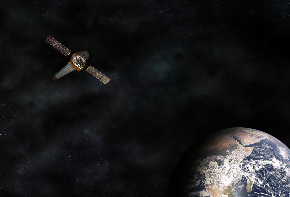 A T-shaped spacecraft over a brown, green and blue sphere