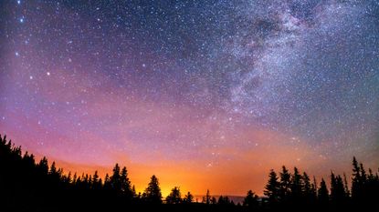 night sky with person to signify lions gate portal