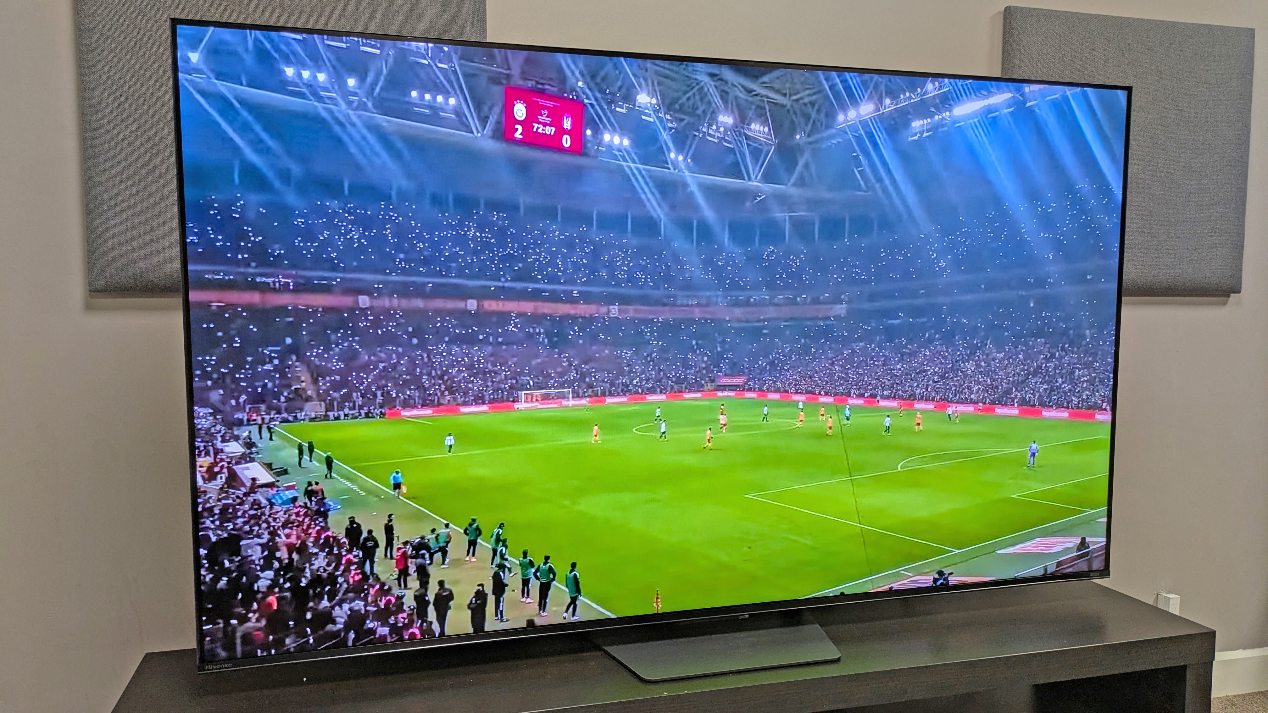 Hisense U7S with footage of a football stadium on screen, taken from a left angle