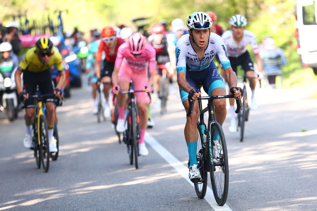 Team Bahrain's Italian rider Antonio Tiberi leads ahead of Team UAE's Slovenian rider Tadej Pogacar during the 8th stage of the 107th Giro d'Italia cycling race, 152km between Spoleto and Prati di Tivo, on May 11, 2024. (Photo by Luca Bettini / AFP)