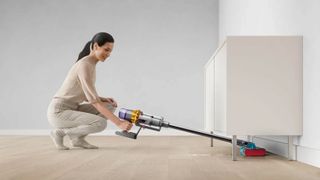 Dyson V15s Detect Submarine mopping under a cabinet