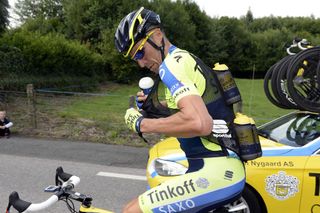 Matteo Tossato carries water-bottles on stage eight of the 2014 Tour de France