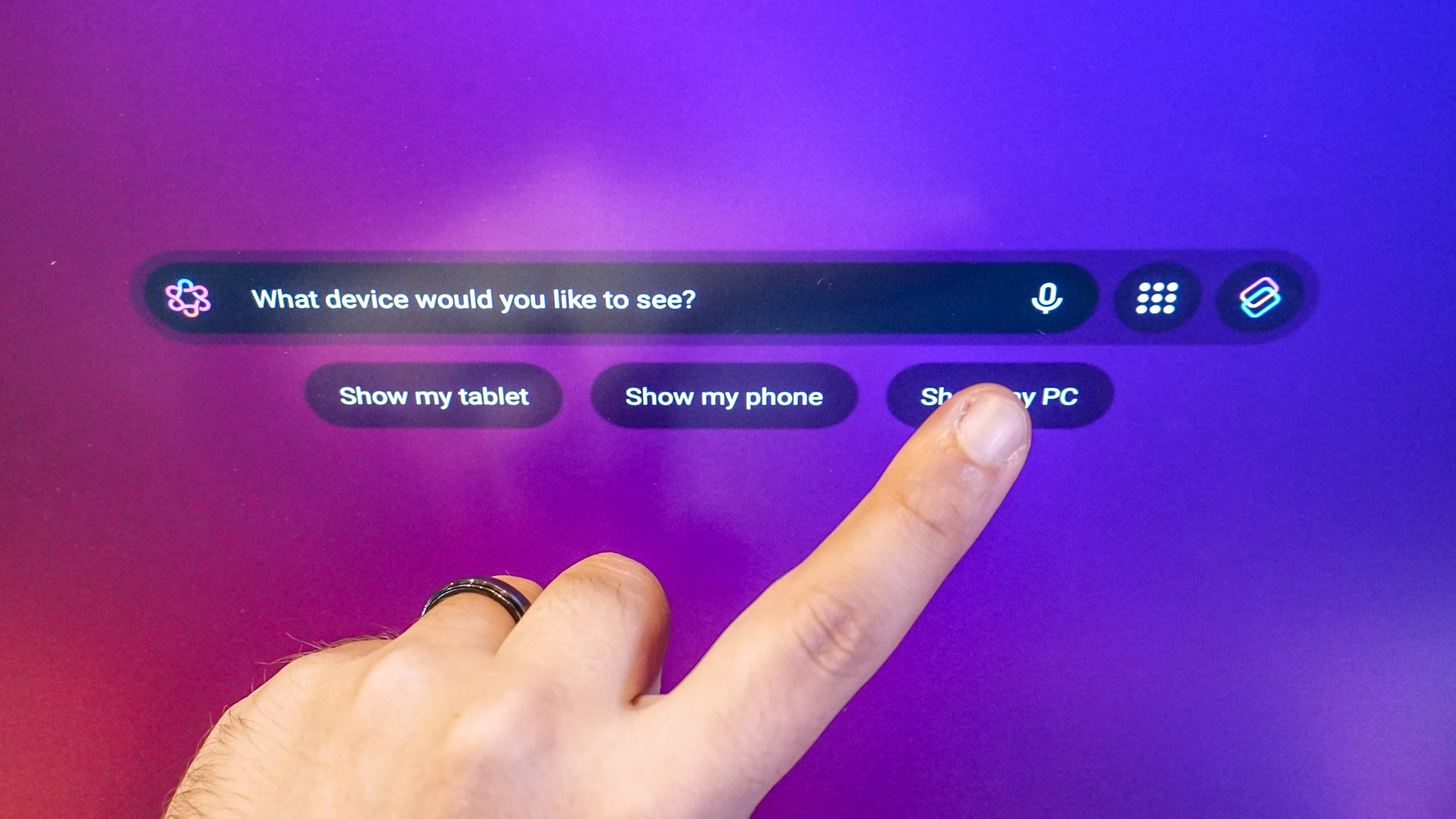 A person using the Qira bar on a Lenovo monitor concept to switch between devices