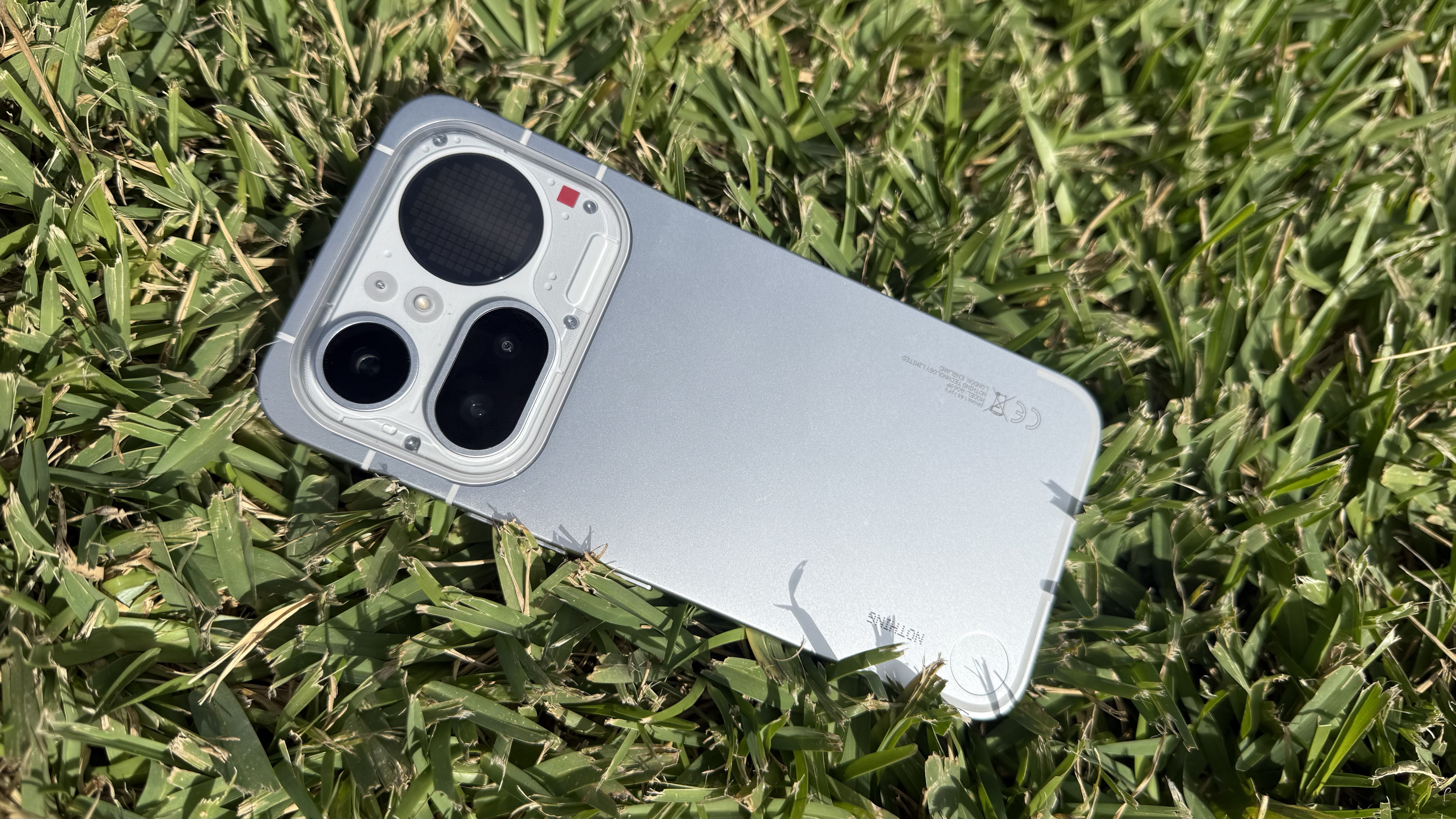 Nothing Phone (4a) Pro on a patch of grass