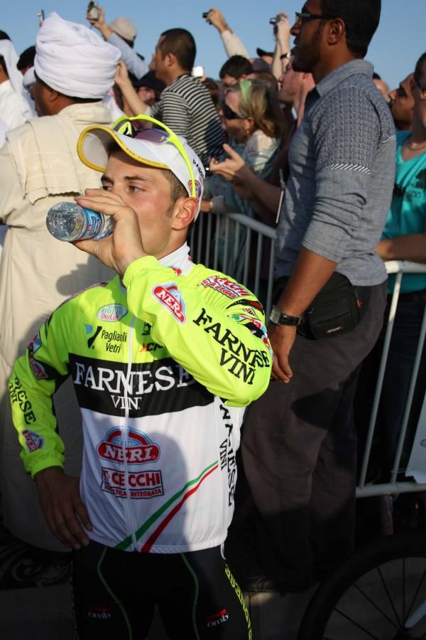 Andrea Guardini (Farnese-Neri) waits to climb onto the podium.